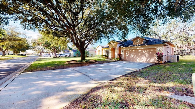 view of front of property featuring a front lawn and a garage