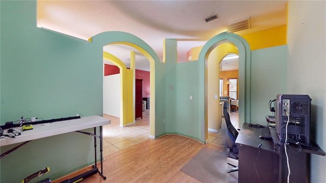 home office with light wood-type flooring