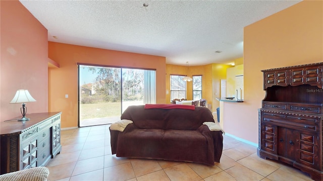 tiled living room with a textured ceiling