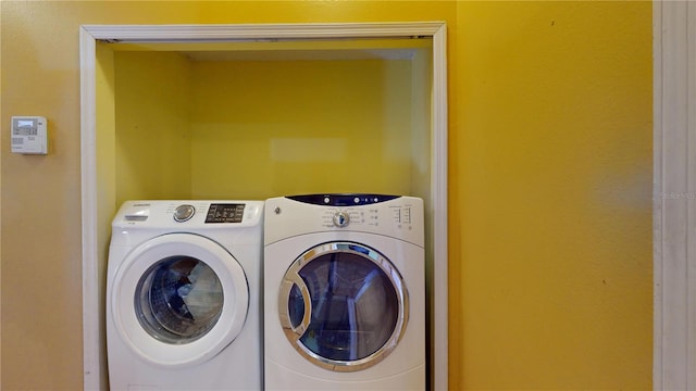 laundry room featuring washer and clothes dryer