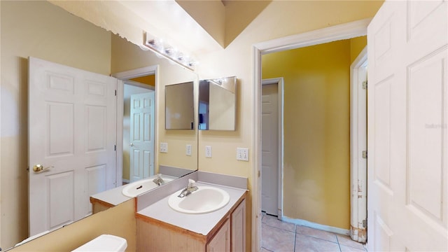 bathroom with tile patterned floors and vanity