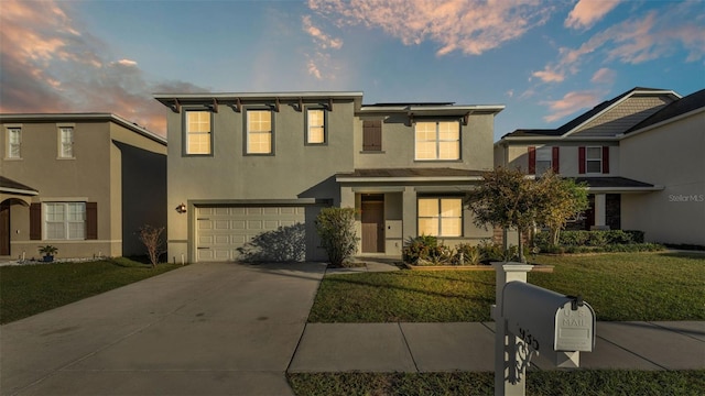 view of front facade featuring a yard and a garage