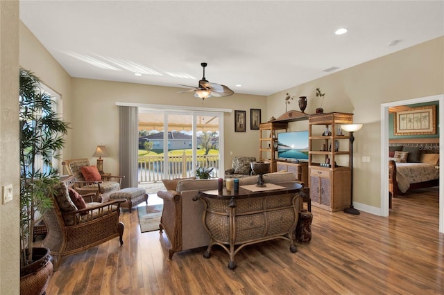 living room with ceiling fan and wood-type flooring