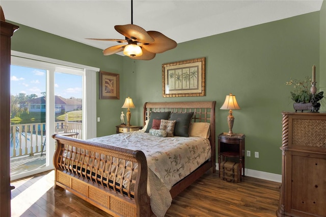 bedroom with access to exterior, ceiling fan, and dark wood-type flooring