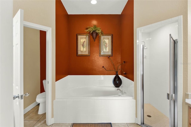 bathroom with plus walk in shower, tile patterned floors, and toilet