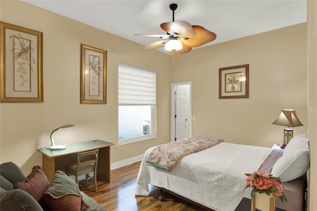 bedroom with hardwood / wood-style flooring and ceiling fan