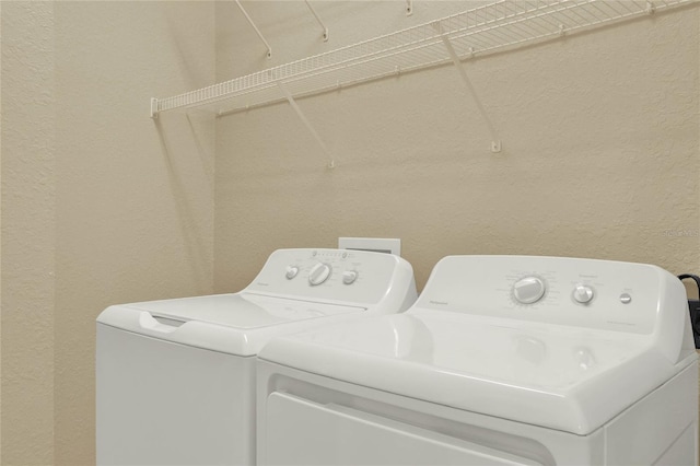 washroom with washing machine and dryer