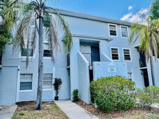 7108 Waterside Dr Unit 103, Tampa, FL 33617 - view of front facade with stucco siding