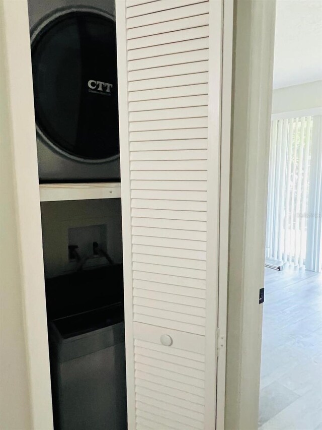 7108 Waterside Dr Unit 103, Tampa, FL 33617 - laundry area featuring stacked washer and clothes dryer