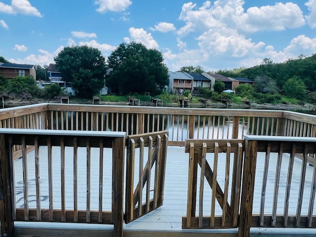 dock area with a deck with water view