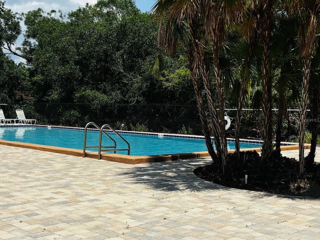 7108 Waterside Dr Unit 103, Tampa, FL 33617 - community pool featuring a patio area