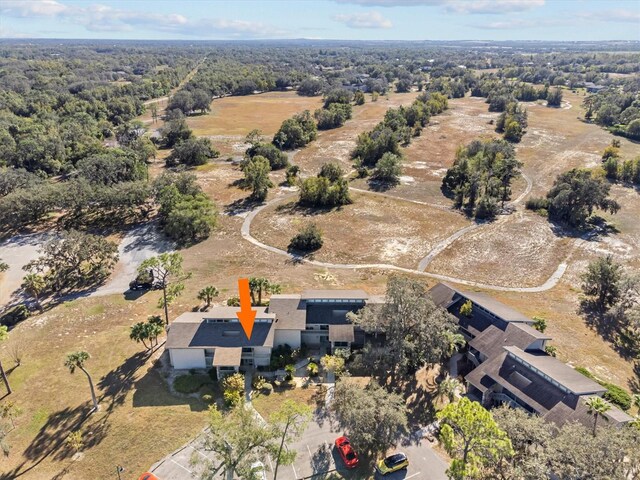 2115 Corner Lake Dr Unit E, Haines City, FL 33844 - aerial view of property's location with a heavily wooded area