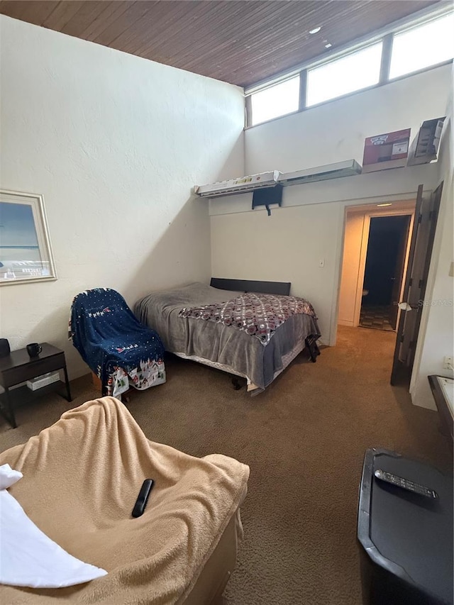 2115 Corner Lake Dr Unit E, Haines City, FL 33844 - carpeted bedroom featuring wood ceiling