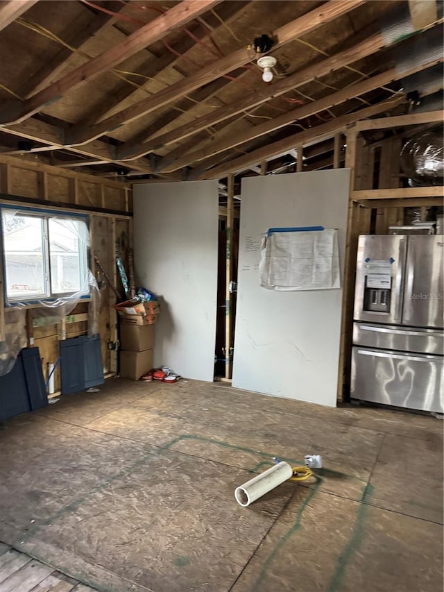 basement with stainless steel fridge