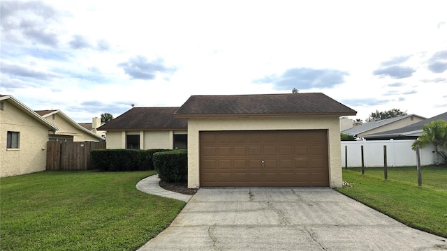 view of front of home with a garage and a front yard