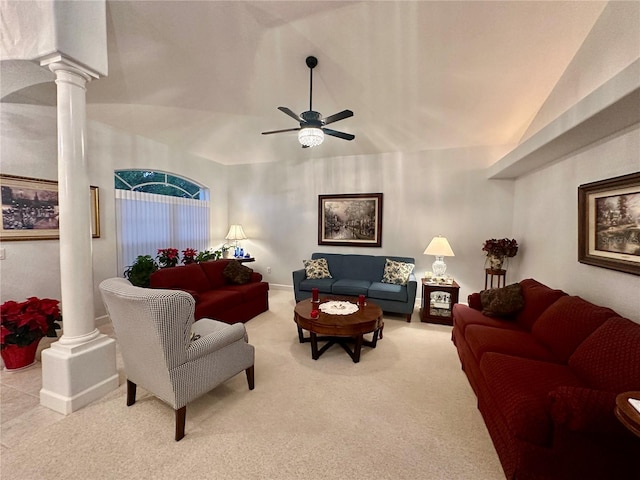 carpeted living room with ornate columns, ceiling fan, and lofted ceiling