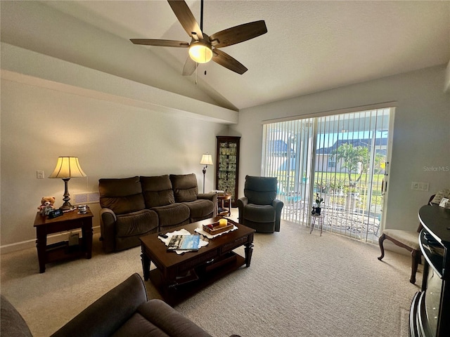 living room with carpet, ceiling fan, and vaulted ceiling