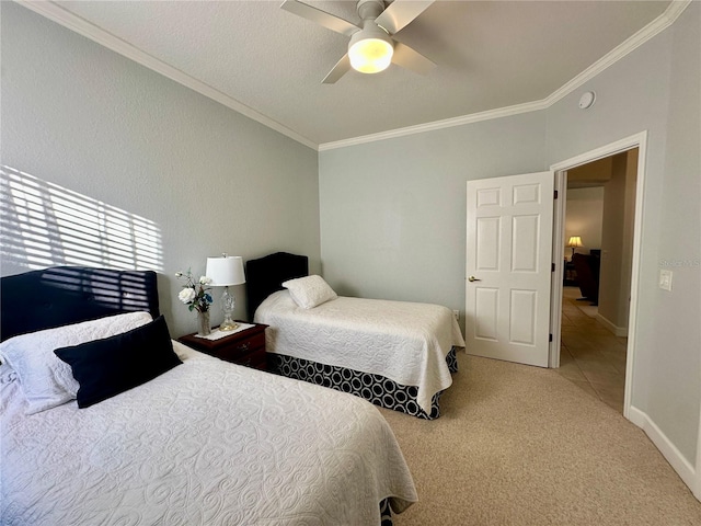 bedroom with carpet, ceiling fan, and crown molding