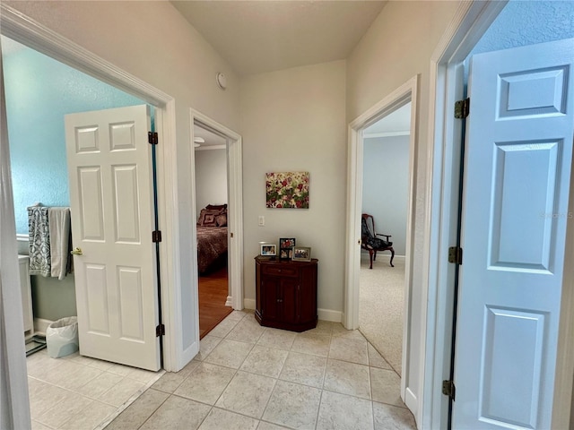 corridor with light tile patterned floors