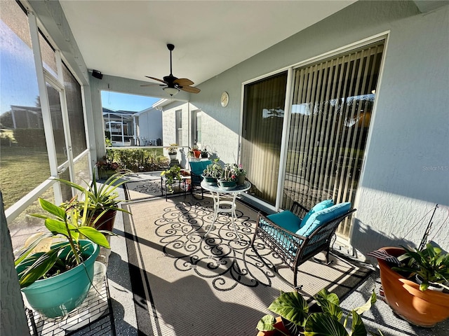 view of patio featuring ceiling fan