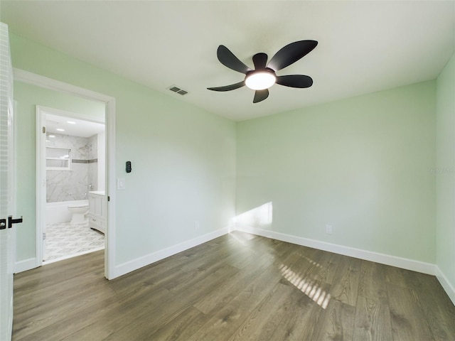 unfurnished room featuring wood-type flooring and ceiling fan