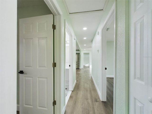 corridor featuring light hardwood / wood-style flooring