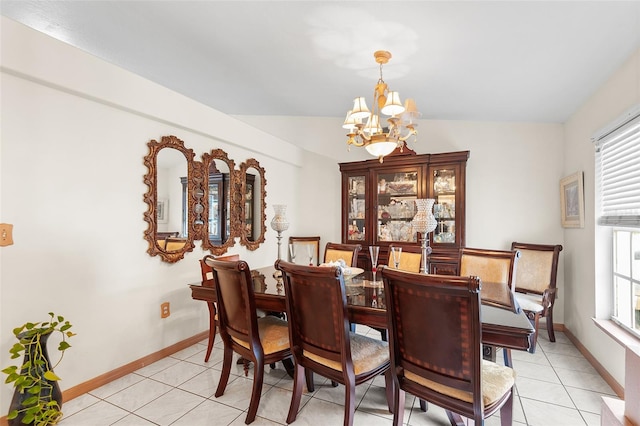 dining area with vaulted ceiling, an inviting chandelier, and light tile patterned flooring