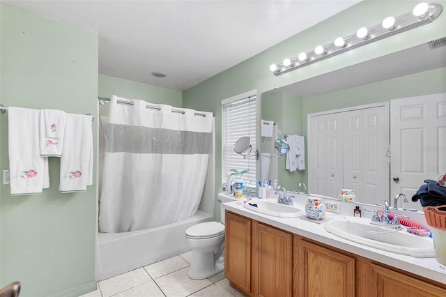 full bathroom featuring tile patterned flooring, shower / tub combo, vanity, and toilet