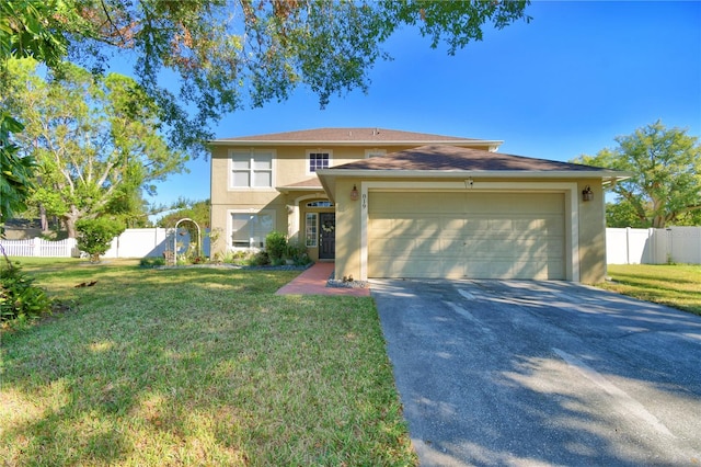 view of front of home featuring a garage and a front yard