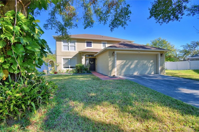 view of front facade featuring a garage and a front lawn