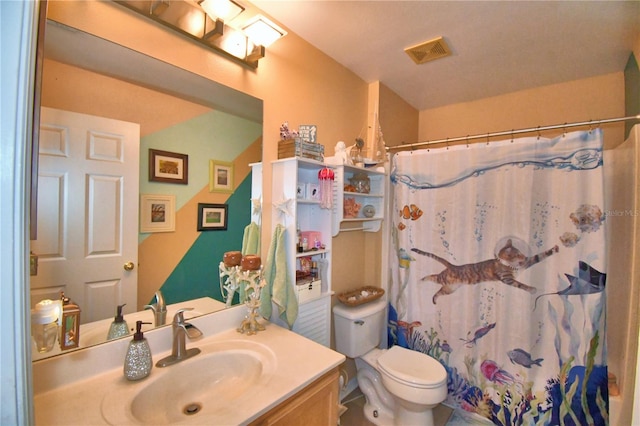 bathroom with a shower with shower curtain, vanity, and toilet