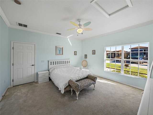 bedroom with ceiling fan, ornamental molding, and carpet floors