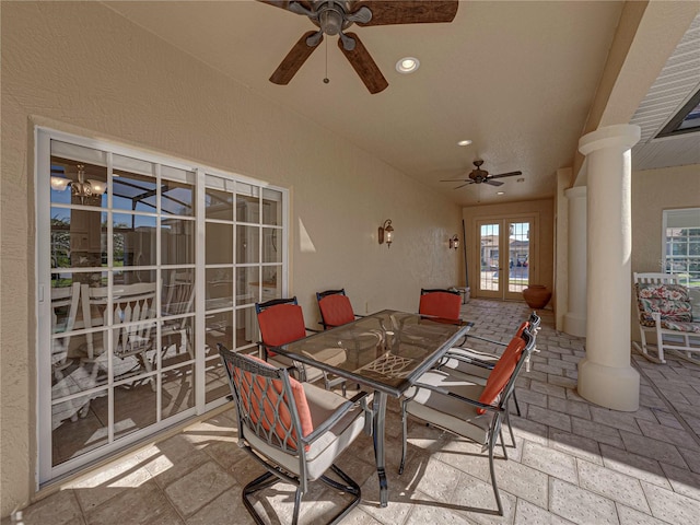 view of patio / terrace featuring glass enclosure, ceiling fan, and french doors