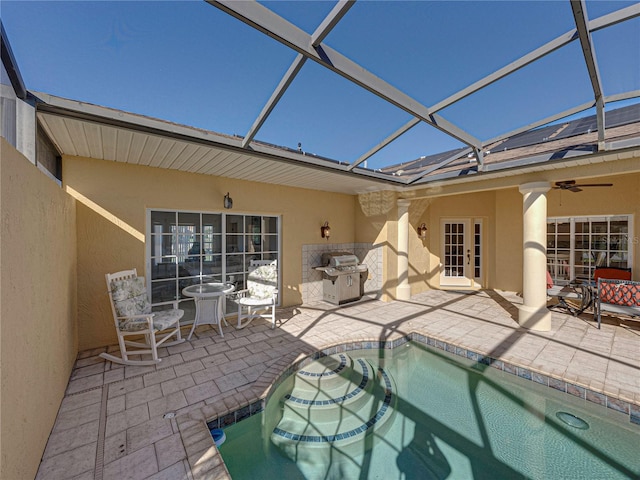 back of house featuring french doors, a lanai, ceiling fan, and a patio area