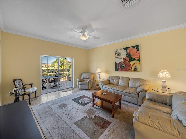 tiled living room featuring ceiling fan and crown molding