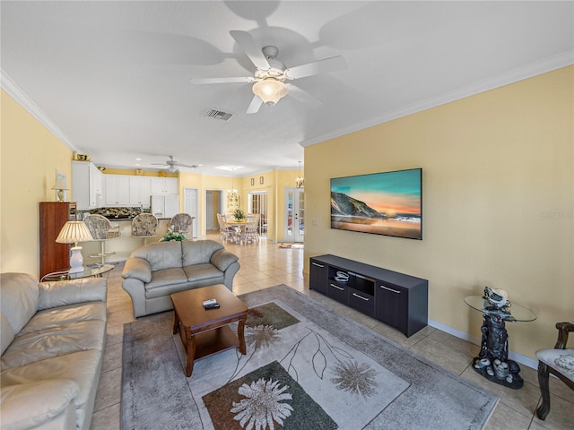 tiled living room featuring ceiling fan and ornamental molding