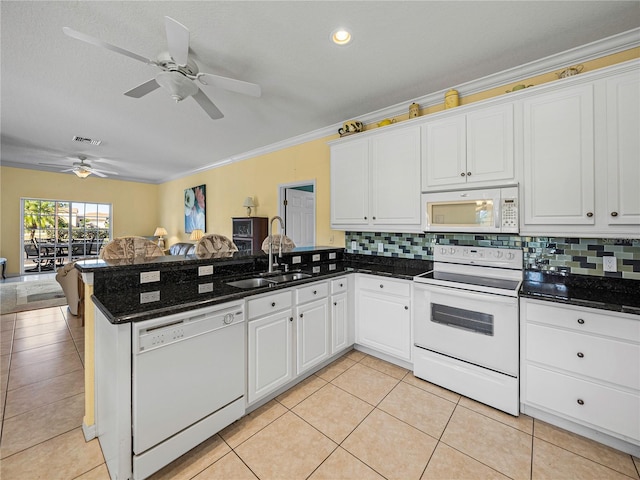 kitchen with kitchen peninsula, white cabinets, white appliances, and ornamental molding