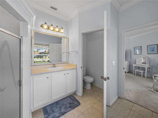 bathroom with tile patterned floors, vanity, crown molding, toilet, and a shower with shower door