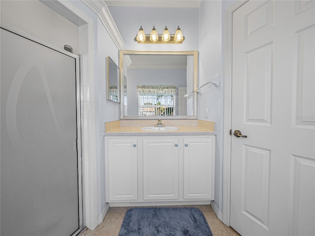 bathroom with crown molding, tile patterned flooring, vanity, and walk in shower