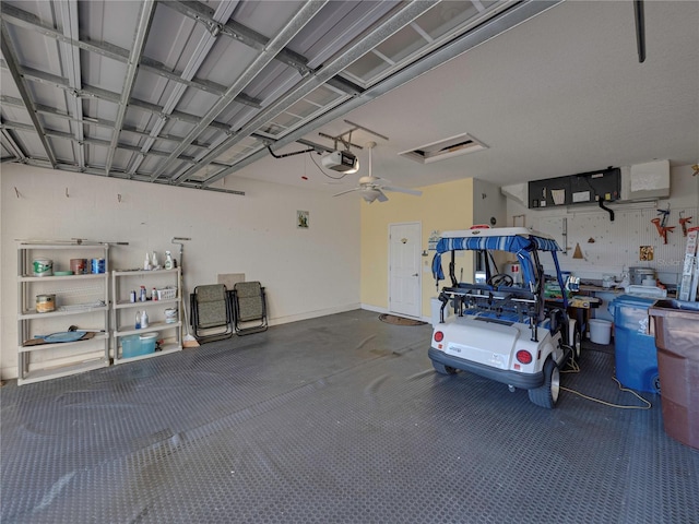 garage featuring ceiling fan and a garage door opener