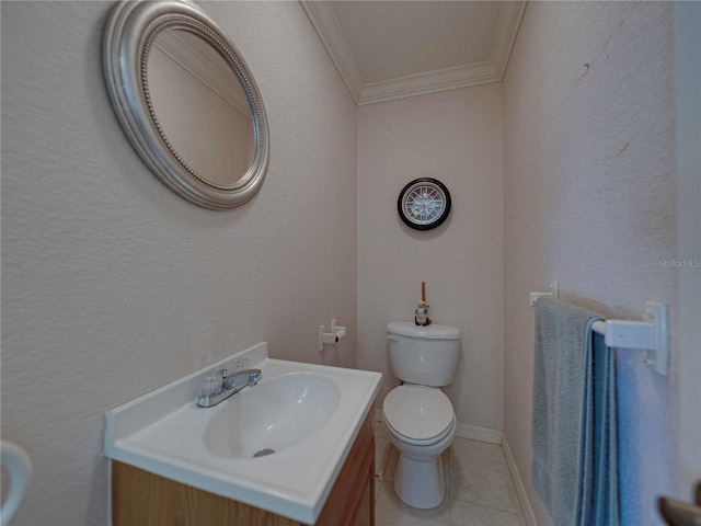 bathroom featuring tile patterned flooring, vanity, toilet, and crown molding