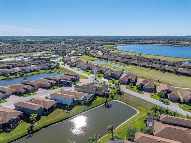 drone / aerial view with a water view