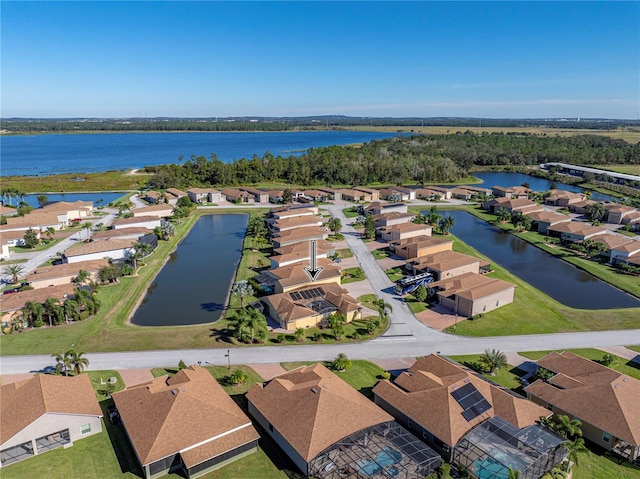 birds eye view of property featuring a water view