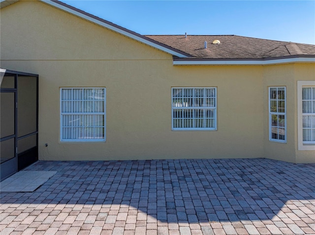 back of property featuring a patio area