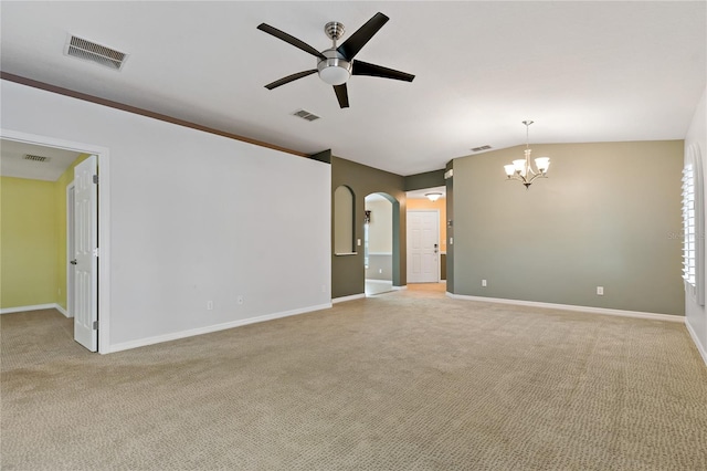 spare room featuring vaulted ceiling, light colored carpet, and ceiling fan with notable chandelier