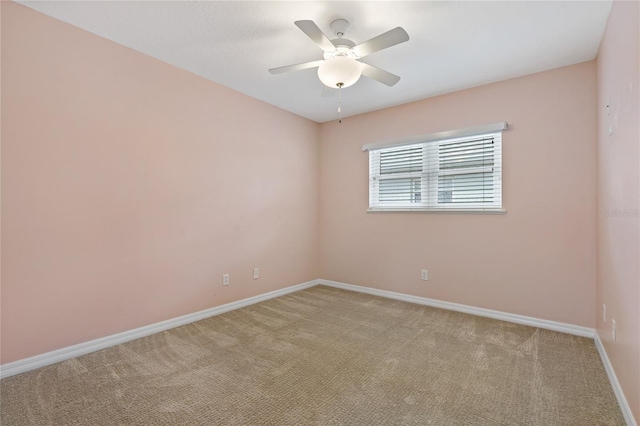 unfurnished room featuring ceiling fan and light colored carpet