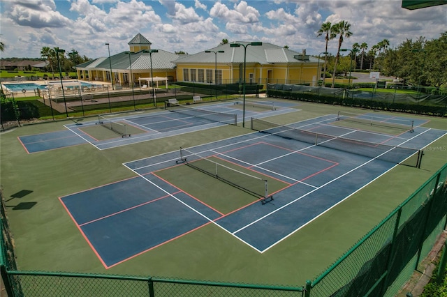 view of tennis court featuring basketball court