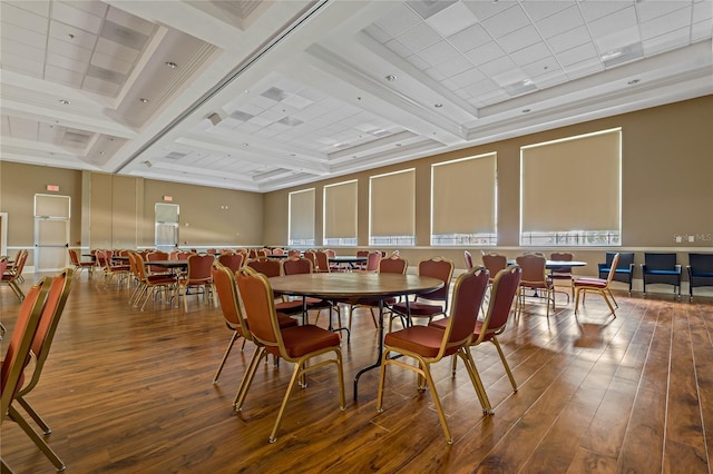 dining area featuring wood-type flooring and beam ceiling