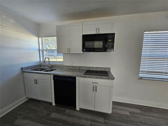 kitchen featuring sink, white cabinetry, and black appliances