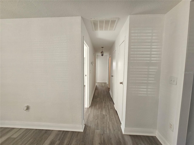 hallway featuring dark hardwood / wood-style flooring